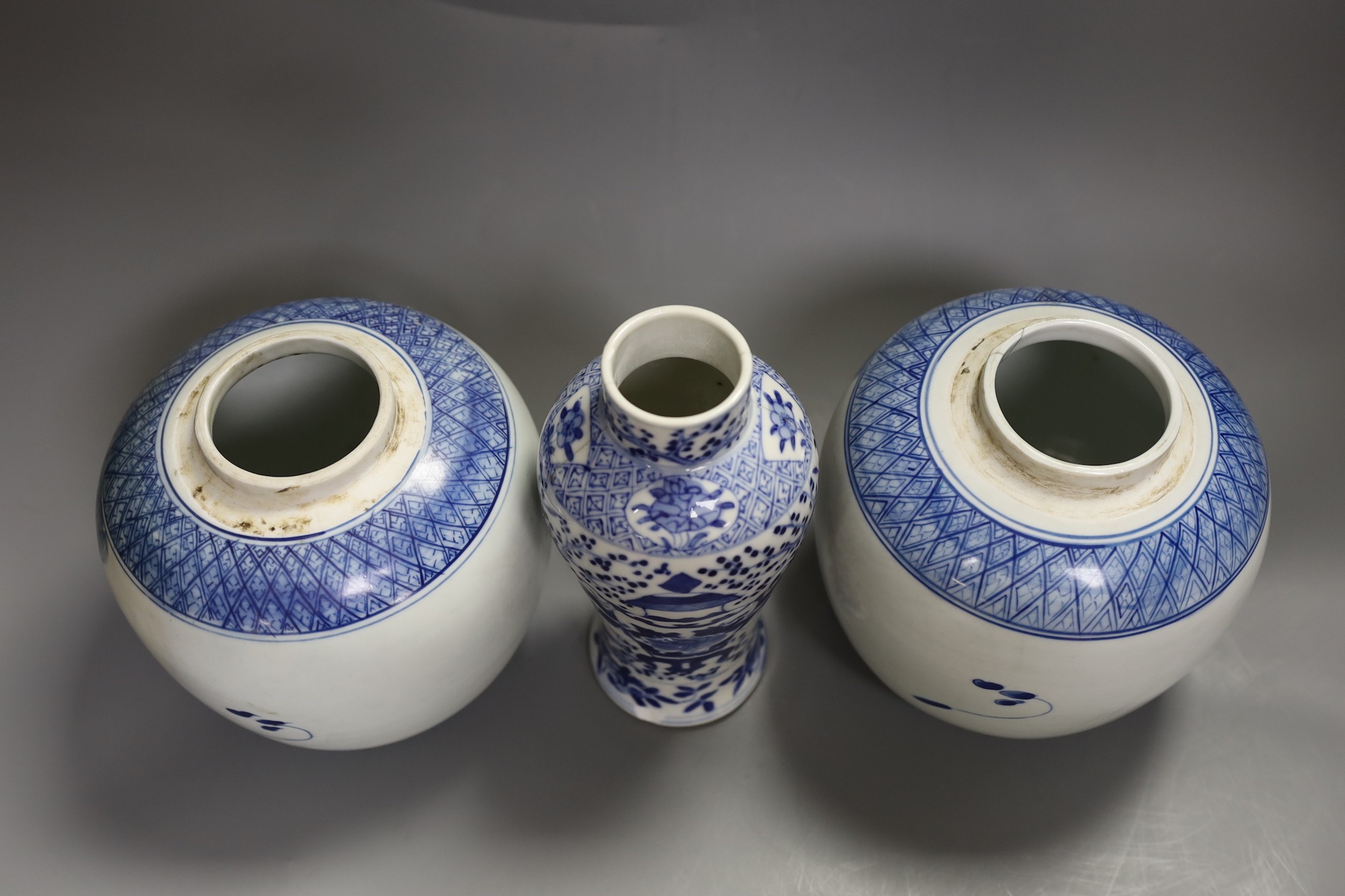 A 19th century Chinese blue and white vase (a.f) and two later jars and covers, tallest 19cm